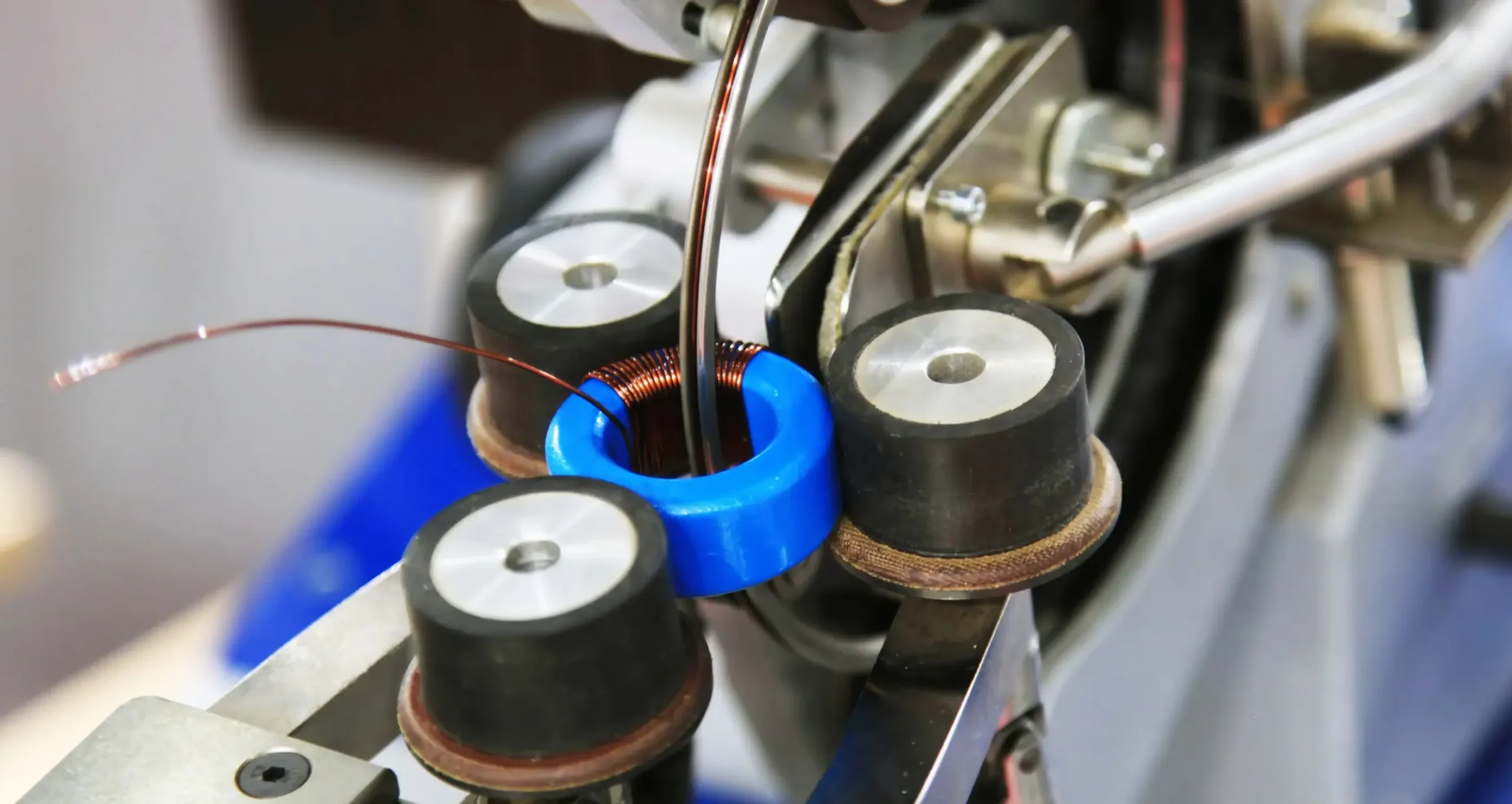 Close-up of manufacturing equipment during a production process, illustrating how do we monitor supplier quality through precision and control.